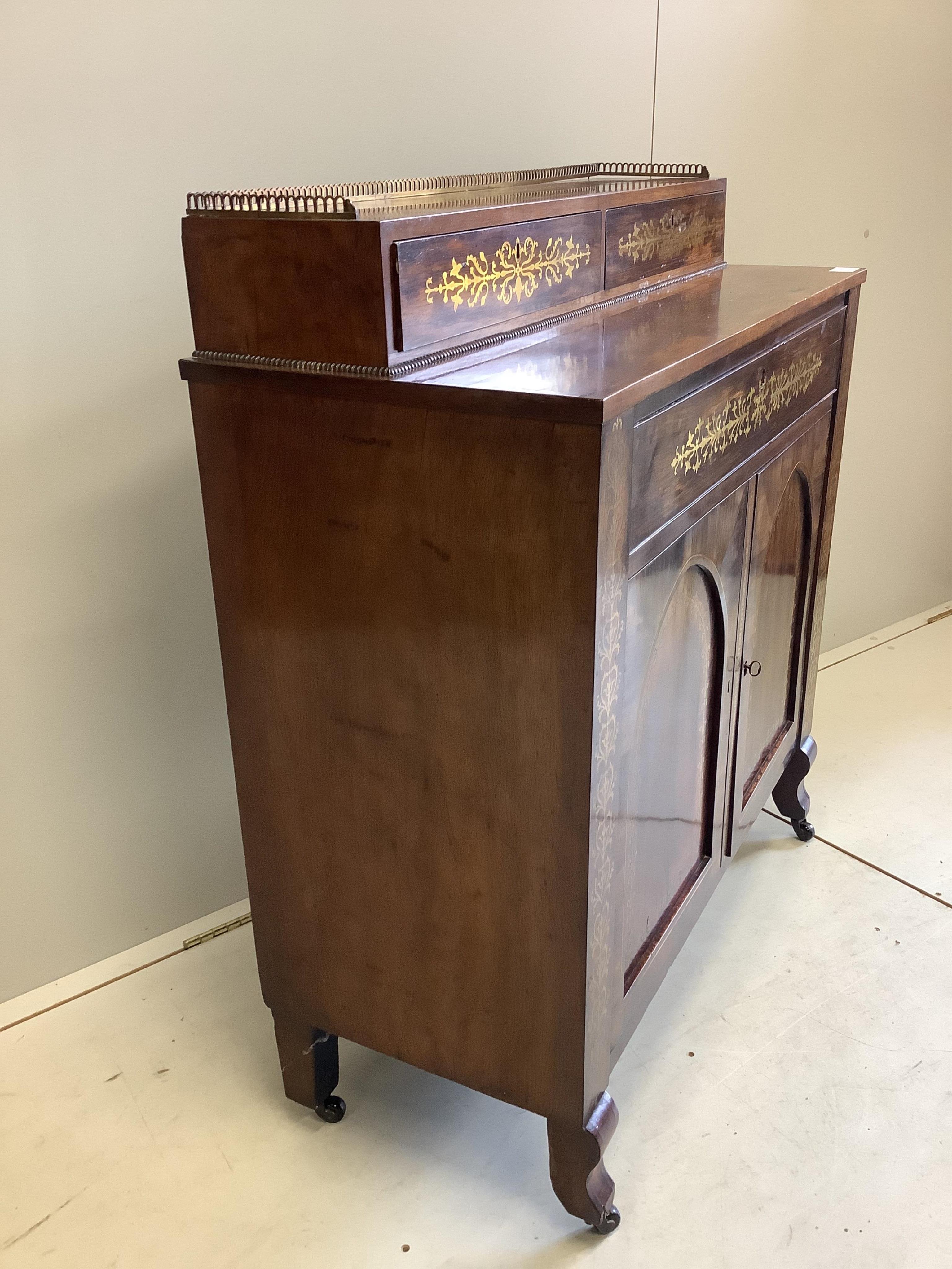 A Regency cut brass inlaid rosewood secretaire cabinet, width 93cm, depth 39cm, height 101cm. Condition - fair